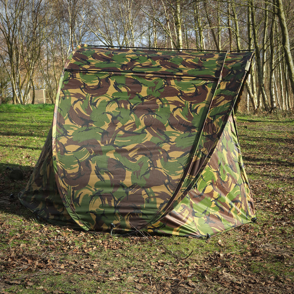 DPM V2 Speedflex bivvy set up in a natural environment, perfect for outdoor enthusiasts who love camo.