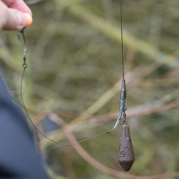 Lead clip leadcore leaders with a weighted lead and swivel, ready for fishing use.