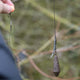 Lead clip leadcore leaders with a weighted lead and swivel, ready for fishing use.