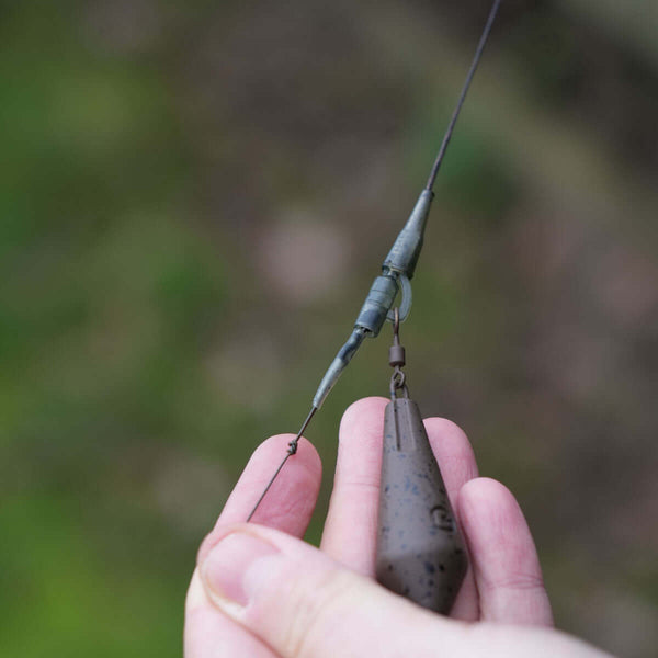 Close-up of lead clip leadcore leaders in hand, showcasing super-heavy leadcore construction and innovative tackle design.