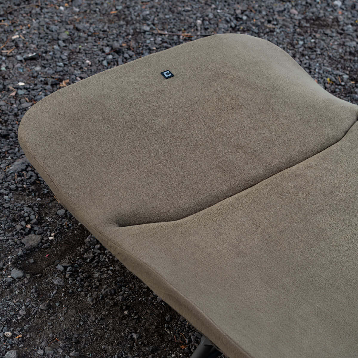 Memory Foam Bedchair Topper featuring a fleece-covered surface and ergonomic design for enhanced comfort.